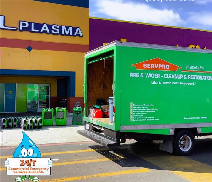 servpro green vehicle parked outside commercial business 