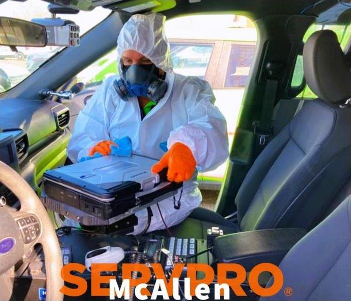 servpro technician disinfection covid cleaning in vehicle 